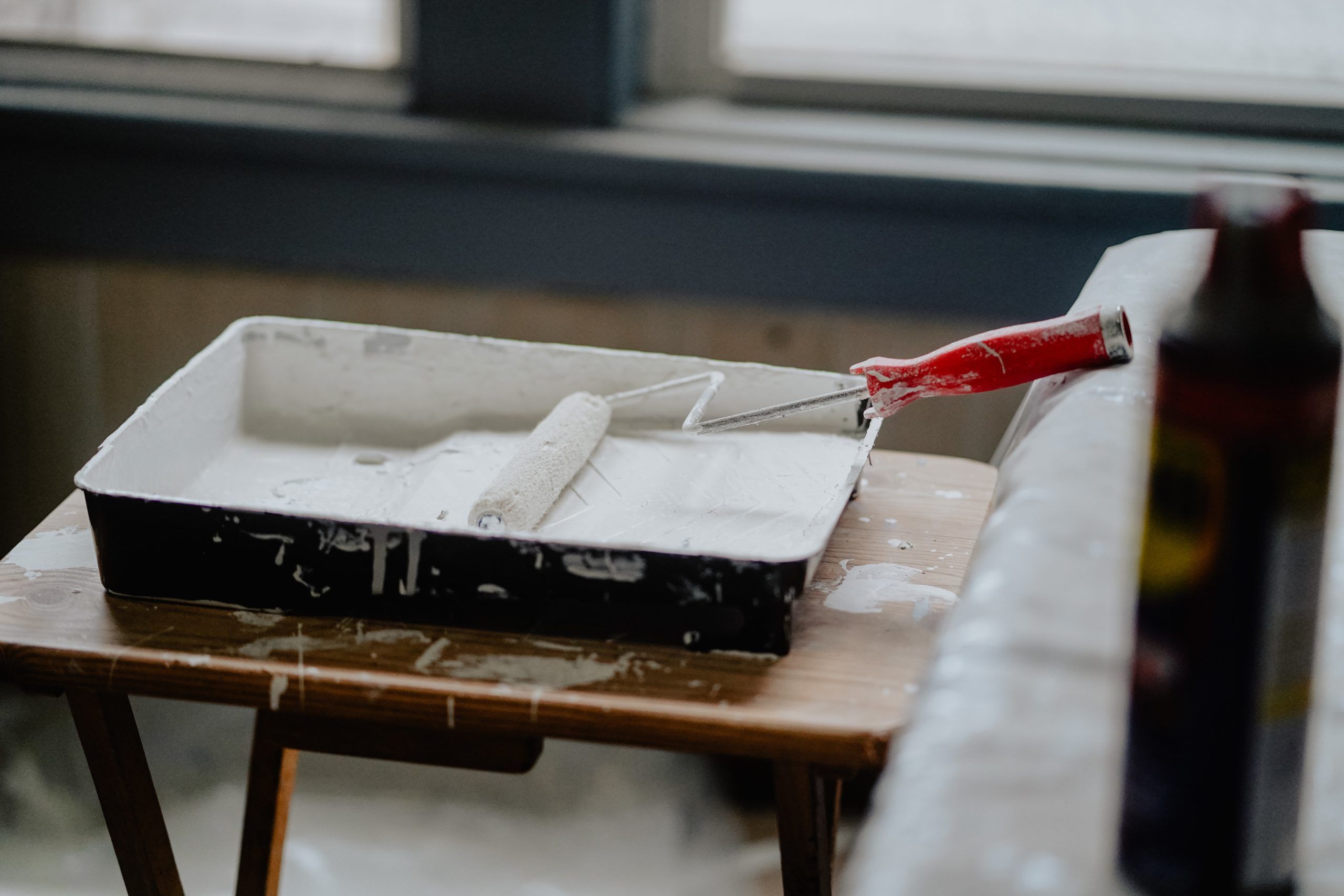 A tray of paint sits on a table for renovation