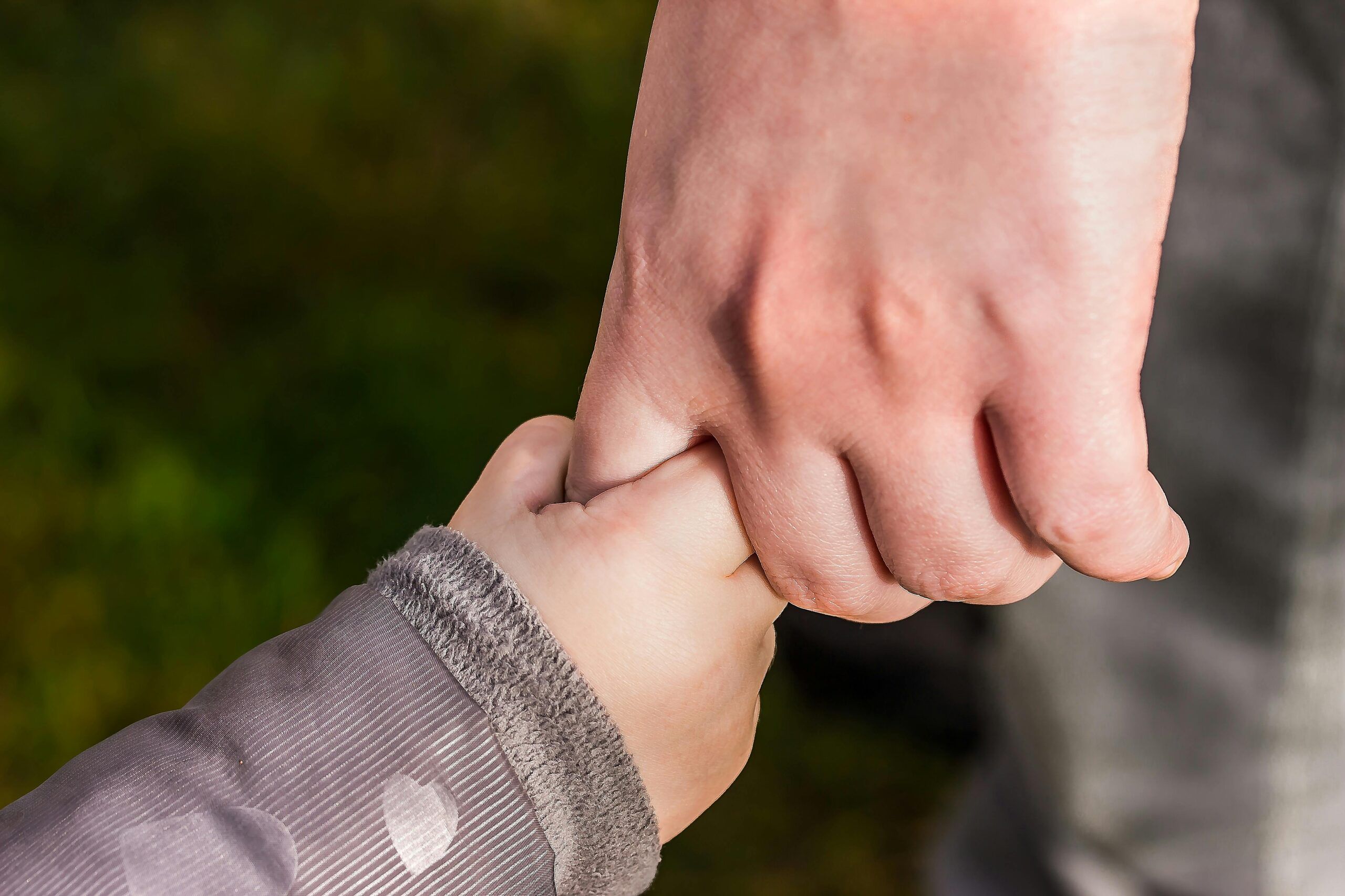 Parenting Holds Hands With Child