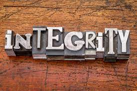 stamped letters create the word integrity