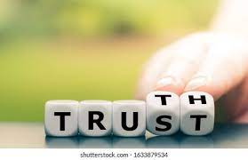 trust and truth are spelled out in white blocks with black letters on them