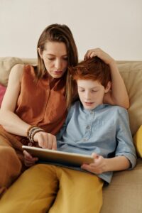 Mom Parenting Son Using Tablet